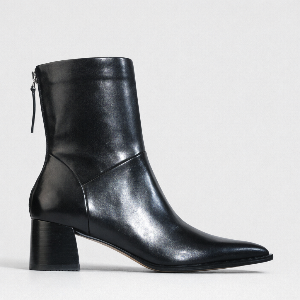 Eos Auroa Black boots with shadow detail, stylish ankle-high footwear featuring sleek black leather and modern design.