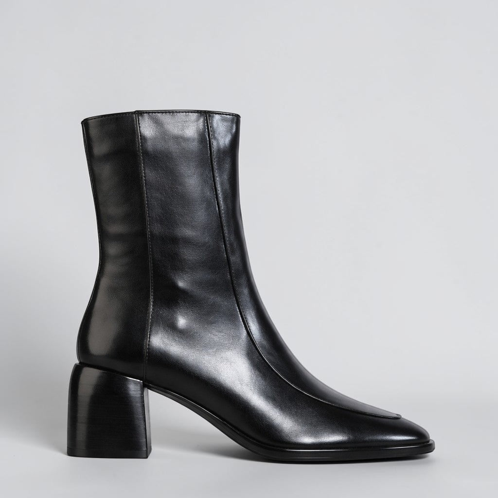Black EOS Charline Boots with sleek design and ankle-high cut, featuring lace-up front and stylish finish.