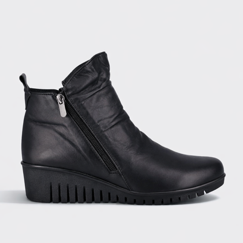 Black Cabello Ella boots with sleek design, rounded toe, and sturdy sole, perfect for stylish everyday wear.