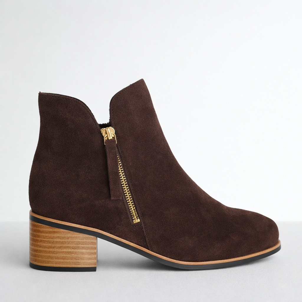Naked Arches Oxley chocolate suede boots with a sleek ankle-high design and stylish stitching details.