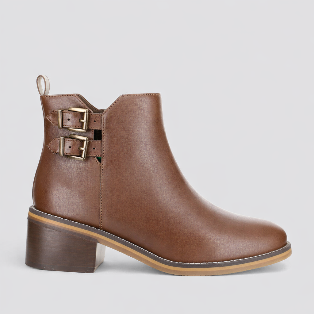 LE SANSA deep chocolate boots with a sleek design, shown on a model, highlighting stylish footwear for winter or casual wear.