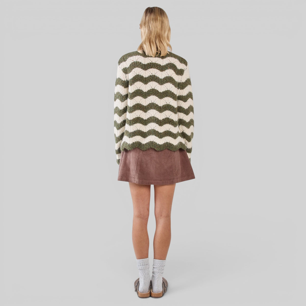 Sass Clothing Nikkita Wavy Stripe Knit Blazer in cream and olive, featuring a stylish wavy stripe pattern, long sleeves, and tailored fit.
