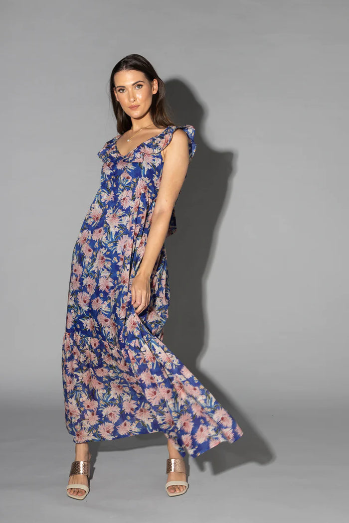 Drama The Label mid summer dress in cyan with a floral pattern, featuring a flowy design and sleeveless style.