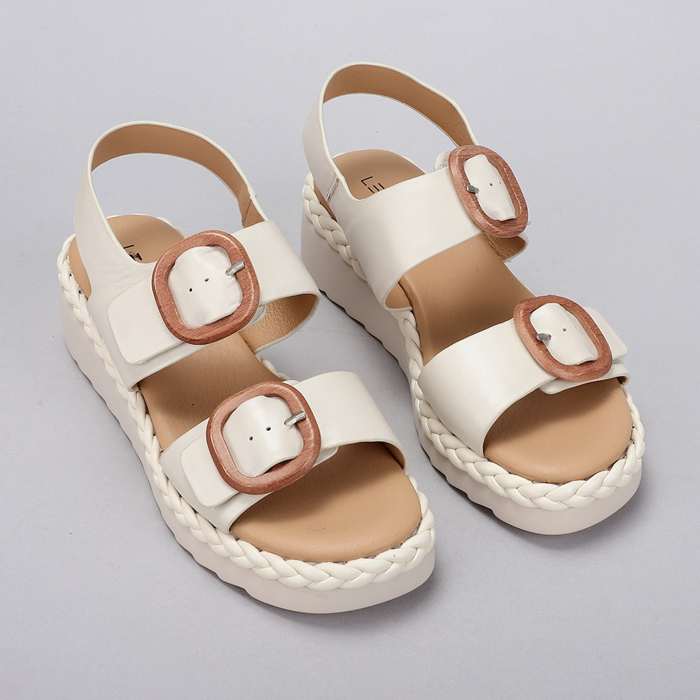 Le Sansa Emery Bone sandals with stylish beige straps and open toe design, perfect for casual summer wear.