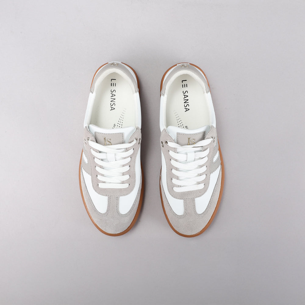 Le Sansa Juno white and light grey sneakers with sleek design and comfortable fit, shown from a side view.