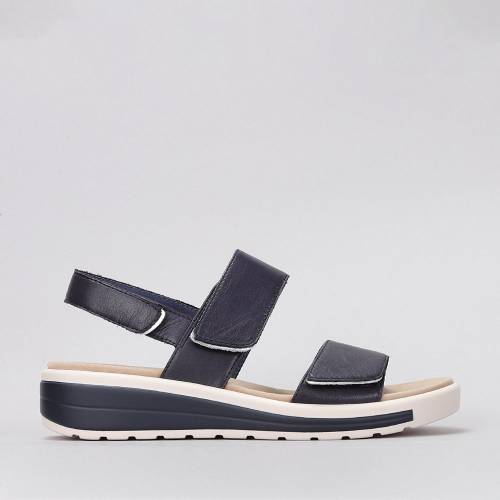 Naked Arches Hanza navy sandals with open toe design, navy straps, and cushioned footbed for comfortable summer wear.