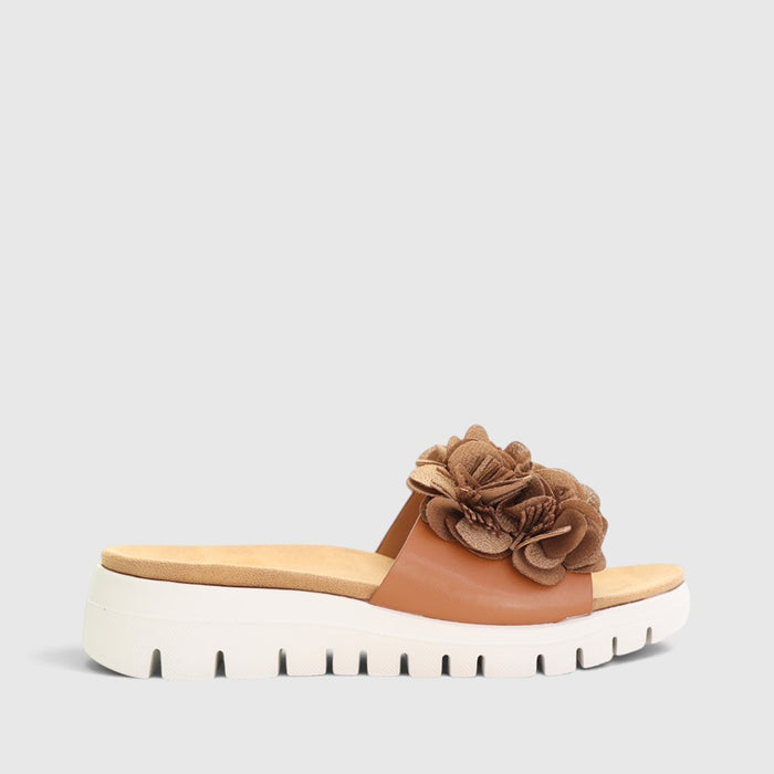 CC Resorts Domo Tan slip-on shoes with a casual design, featuring a tan color and comfortable fit.