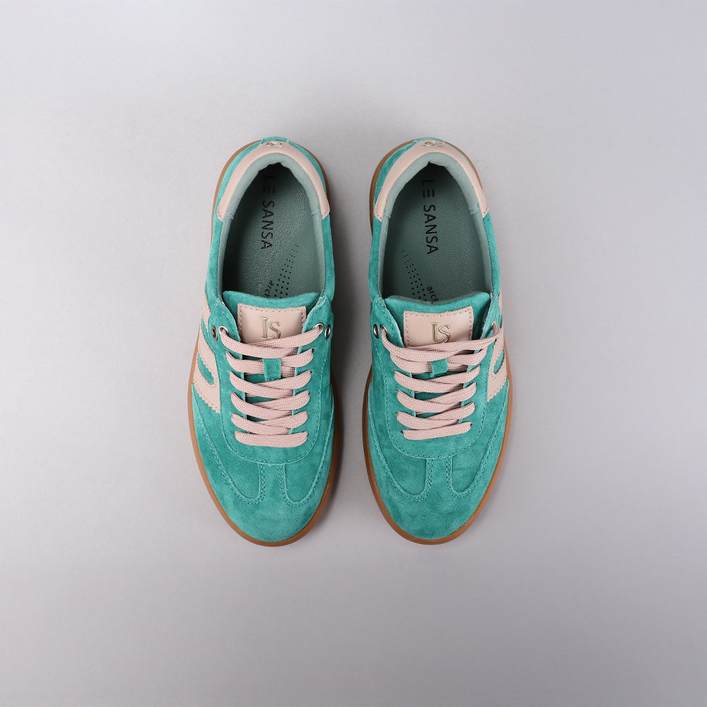Le Sansa Juno sneakers in pine green and taupe with stylish laces and modern design, perfect for casual wear.