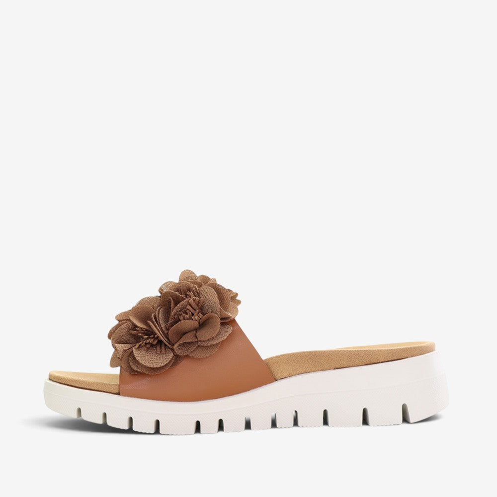 CC Resorts Domo Tan slip-on shoes featuring a comfortable design and tan color, perfect for casual wear.