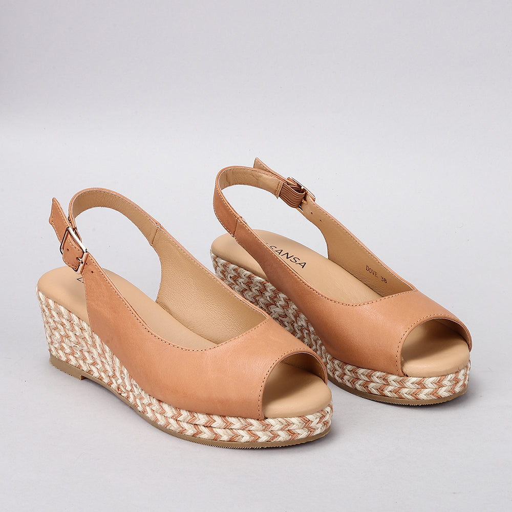 Le Sansa Dove Tan sandals featuring sleek straps and open toe design, perfect for casual summer wear.