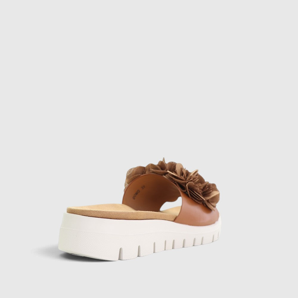 CC Resorts Domo Tan slip-on shoes featuring a casual design and comfortable fit, shown in a tan color.