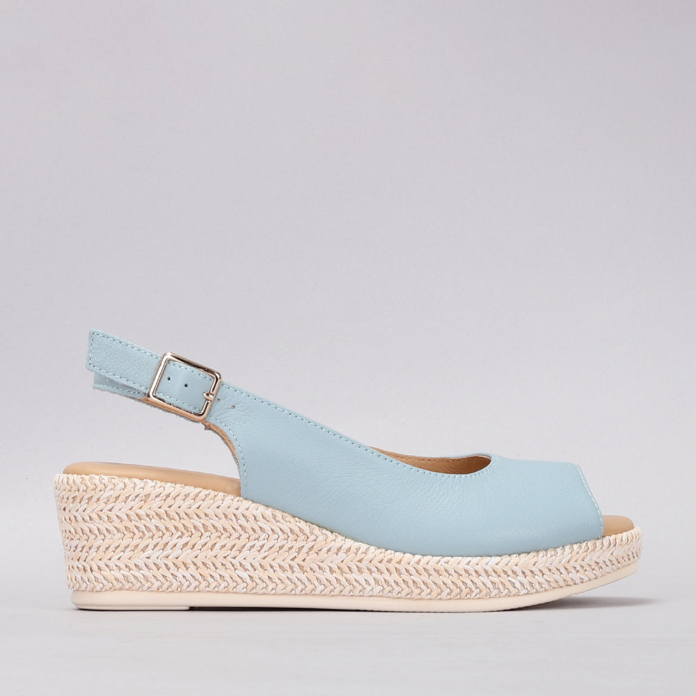 Le Sansa Petunia Baby Blue sandals featuring soft straps and a comfortable sole, ideal for casual wear.