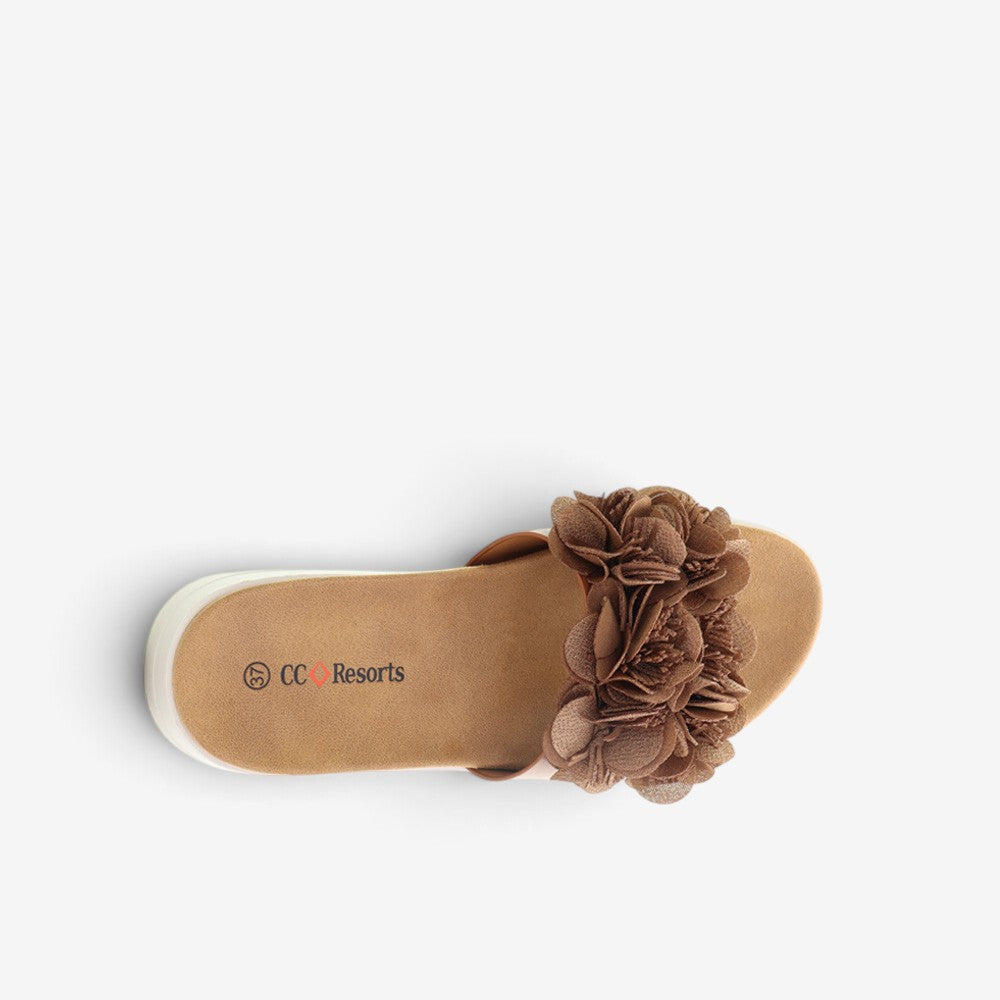 CC Resorts Domo Tan slip-on shoes featuring a casual design and tan fabric upper, ideal for comfortable everyday wear.
