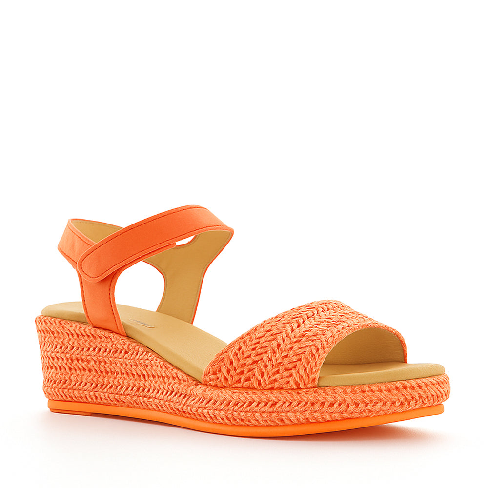 Le Sansa Pilia Orange sandals with strappy design and flat sole, perfect for casual summer wear.