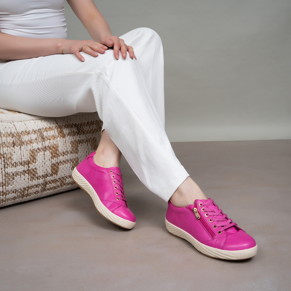 Naked Arches Alia Hot Pink sneakers with vibrant pink design, breathable fabric, and sporty laces for athletic and casual wear.