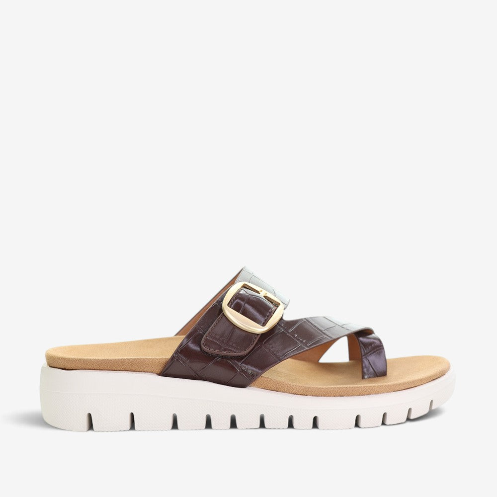CC Resorts Domino Chocolate Crocs slip-ons featuring a sleek chocolate brown design and comfortable casual style.