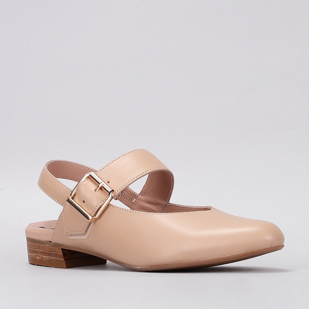 NAKED ARCHES Yoko Sandals with minimalist design, tan leather straps, and flat sole, displayed on a neutral background.
