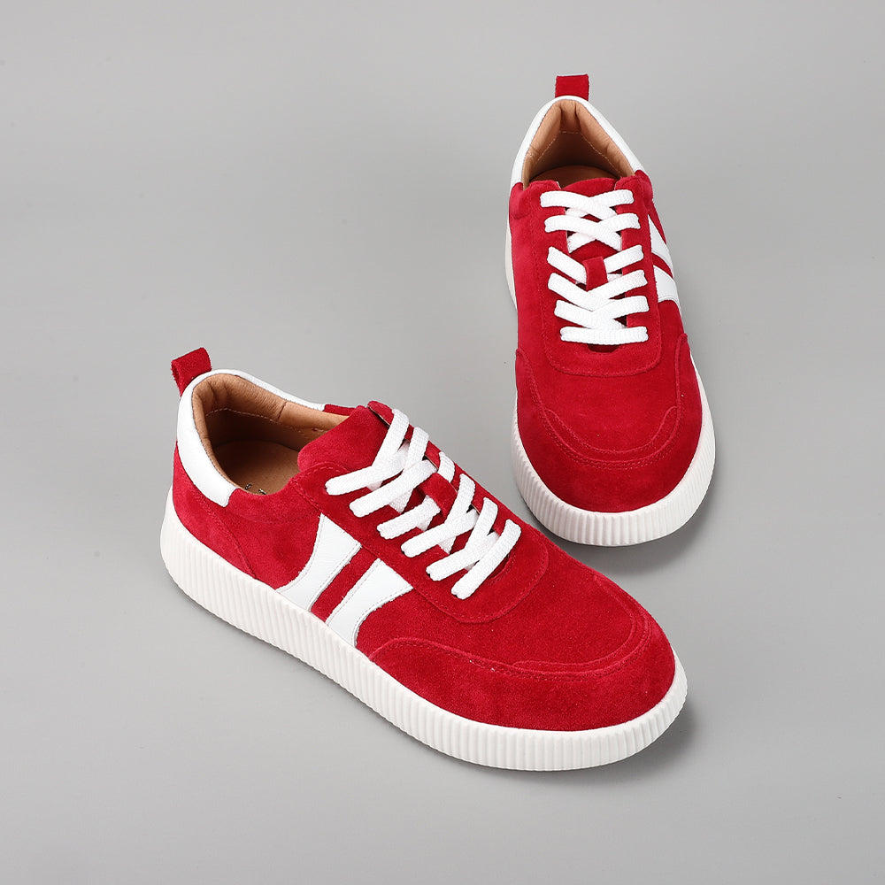 Le Sansa Comet red suede sneakers with white soles and stylish design, showcasing vibrant red suede material and modern athletic style.