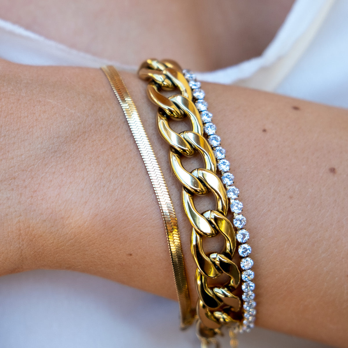 Gold plated snake chain bracelet from A & C Oslo featuring a sleek, twisted design and a secure clasp.