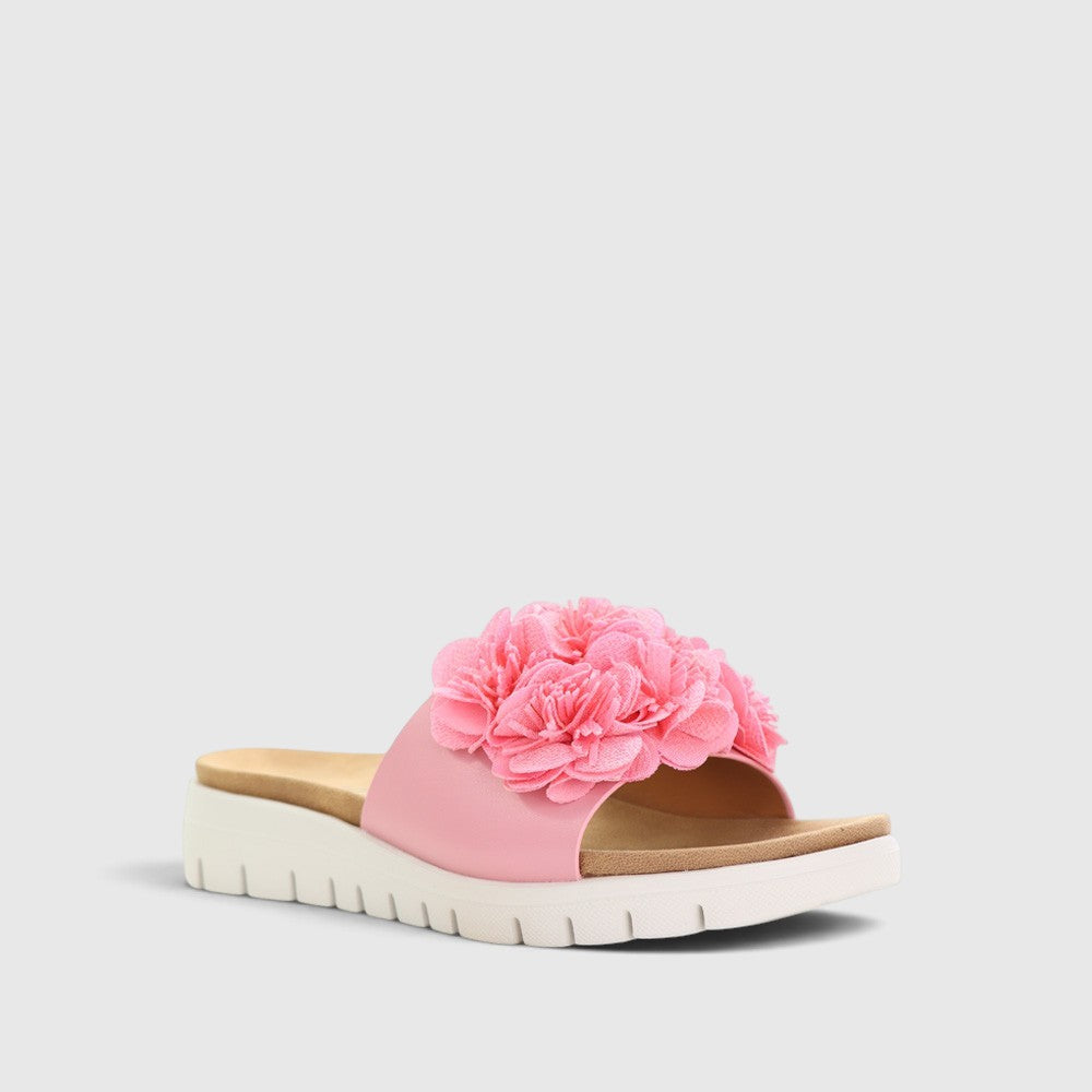 Pink CC Resorts Domo baby slip-on shoes with soft fabric and cute Domo character design for infants.