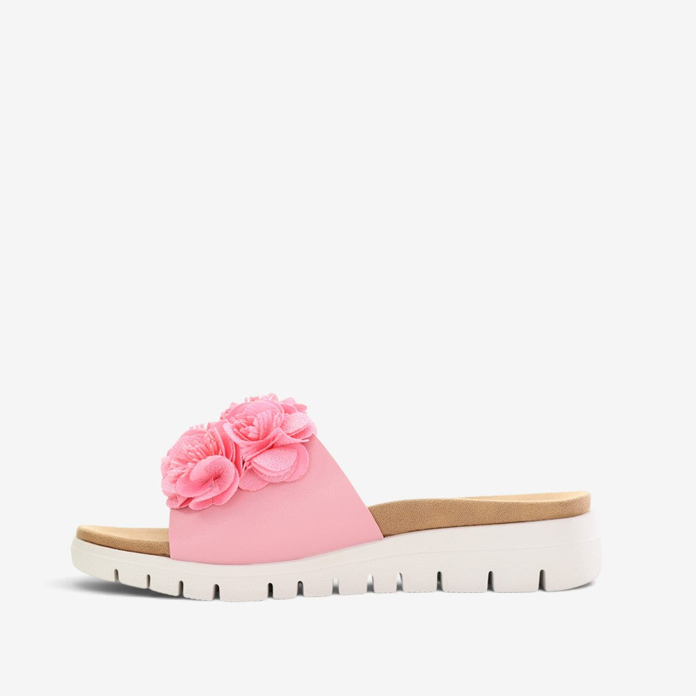 Pink CC Resorts Domo baby slip-on shoes with soft fabric and playful design, perfect for comfortable little feet.