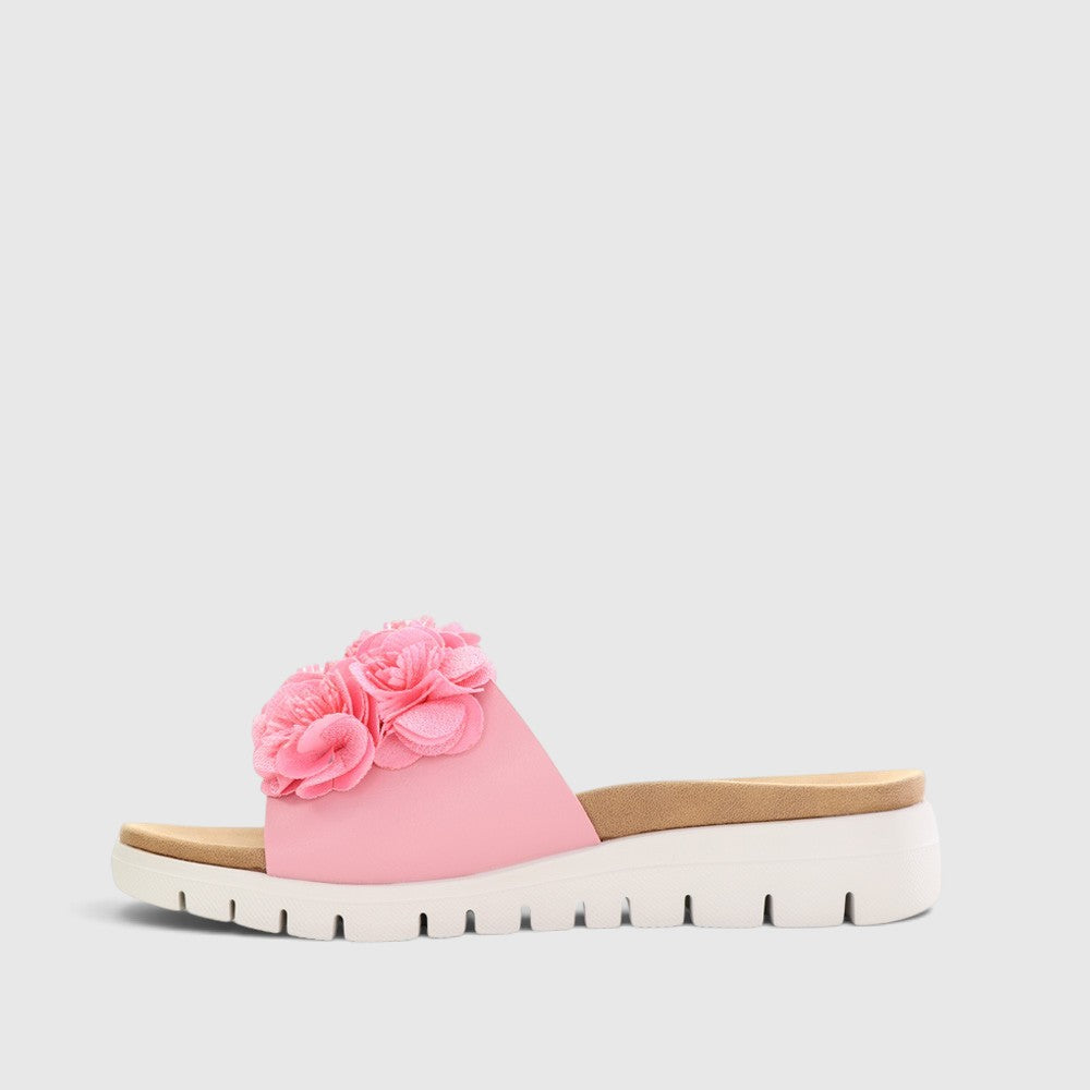 Pink CC Resorts Domo baby slip-on shoes for infants, featuring a soft fabric upper and comfortable sole.