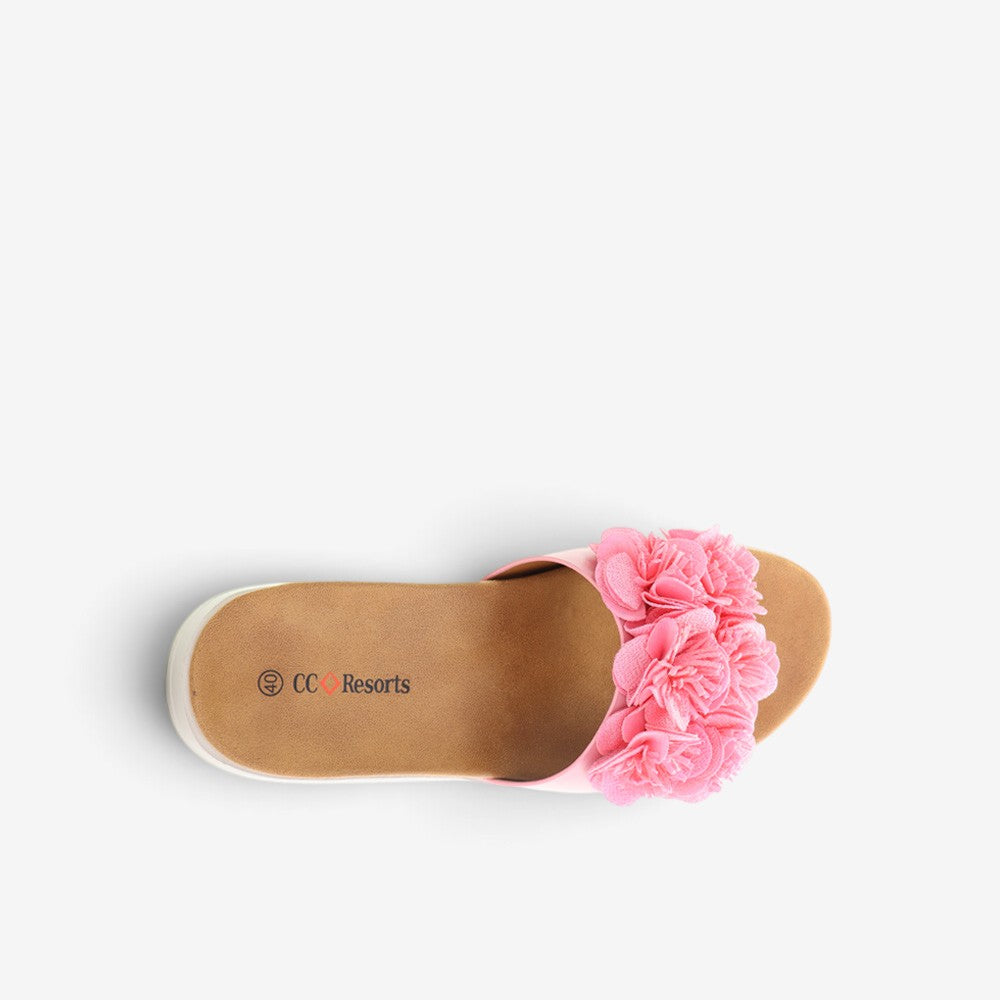 Pink CC Resorts Domo baby slip-on shoes for infants, featuring a soft fabric upper and comfortable sole.