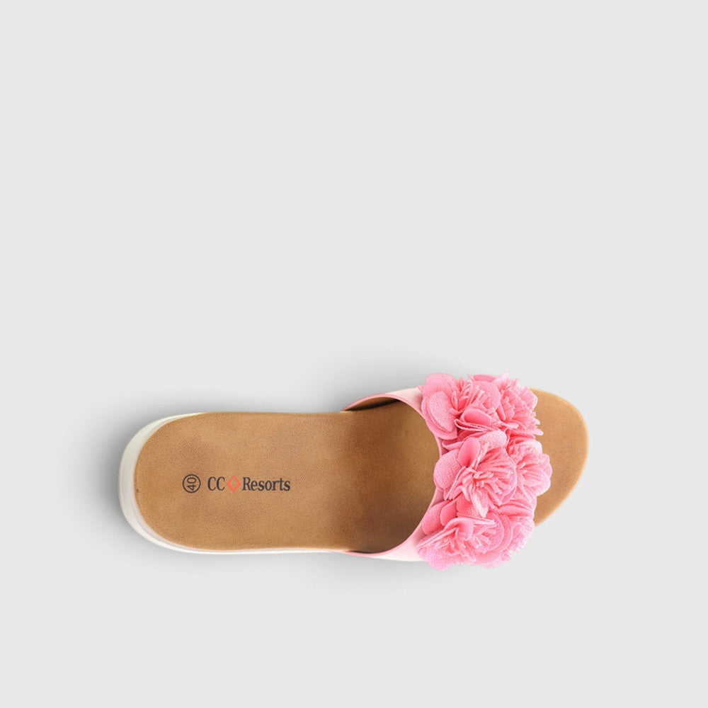 Pink slip-on shoes for babies by CC Resorts featuring a soft, comfortable design perfect for little feet.