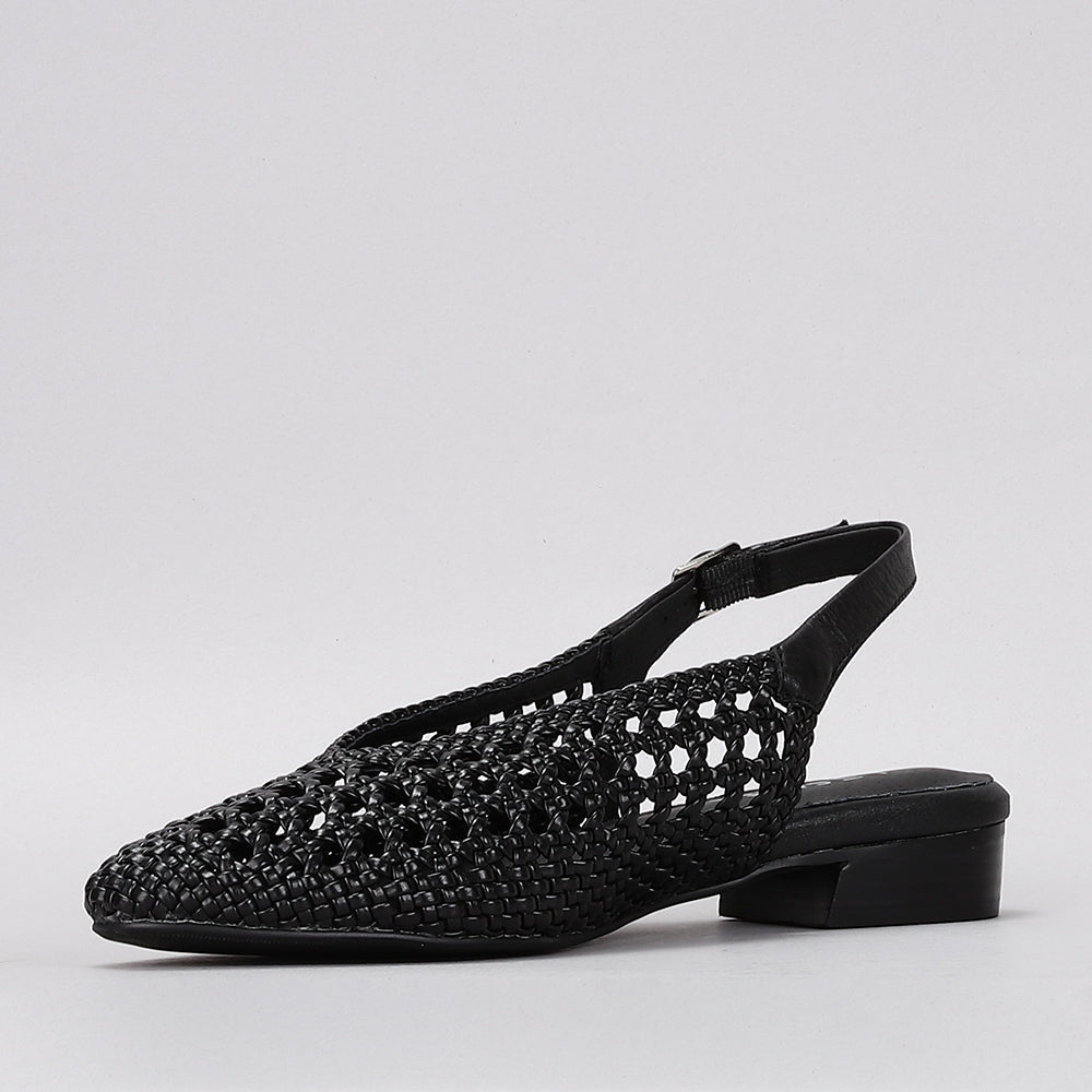 Black Le Sansa Sansa Camila sandals with open toes and ankle straps, stylish footwear for casual or summer wear.