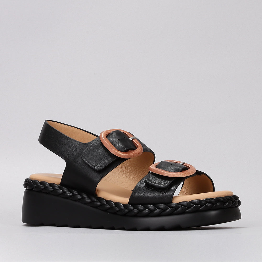 Le Sansa Sansa Emery black sandals with open toes and ankle straps, showcasing stylish footwear design.