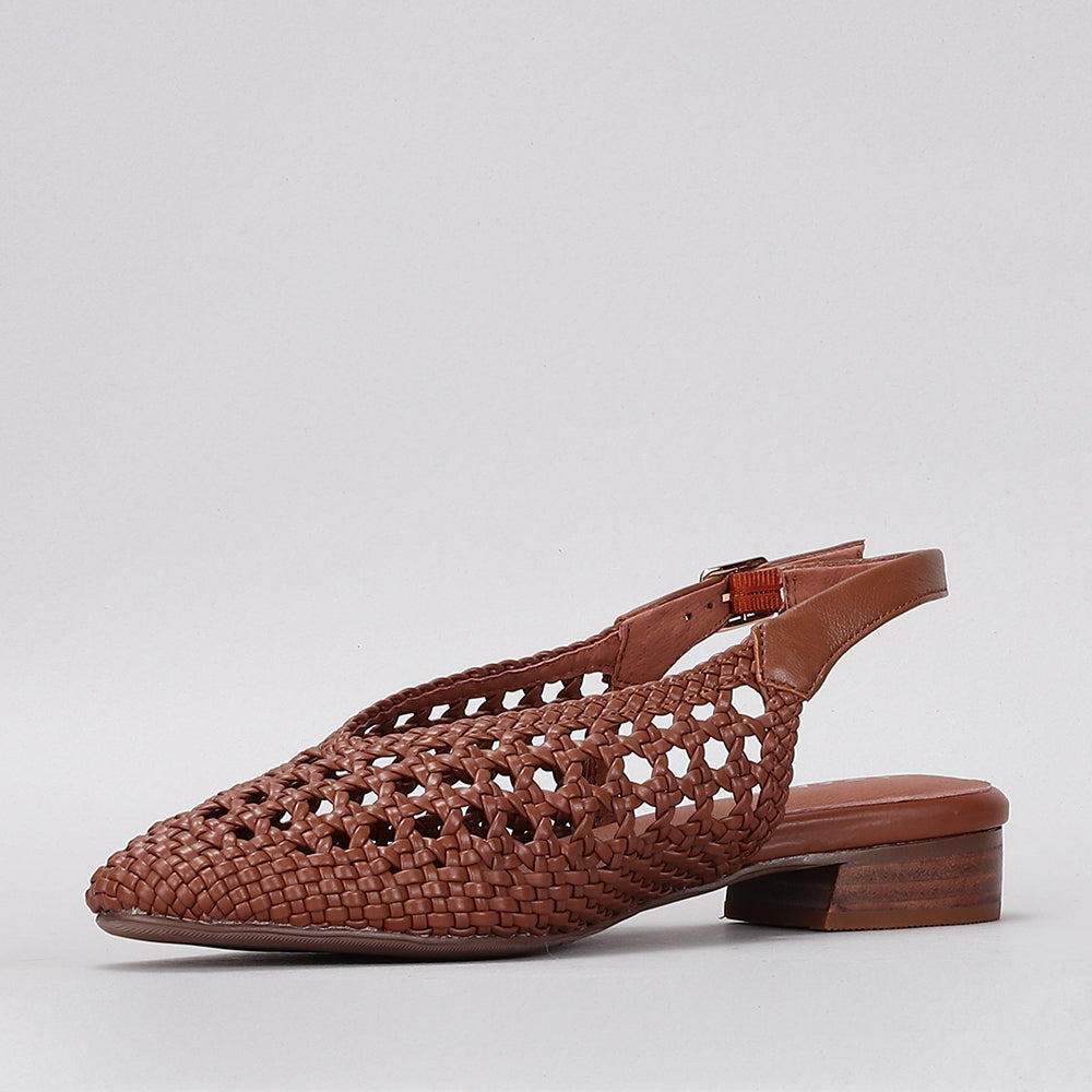 Le Sansa Camila Walnut sandals featuring tan leather straps and a comfortable flat sole on a neutral background.