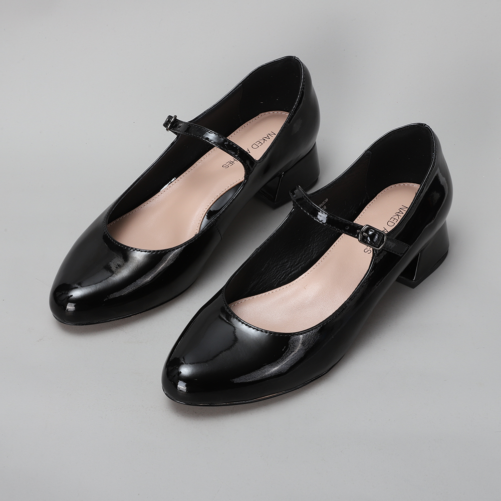 Black patent NAKED ARCHES sandals with sleek arch design, featuring a stylish open-toe strap and adjustable ankle strap.