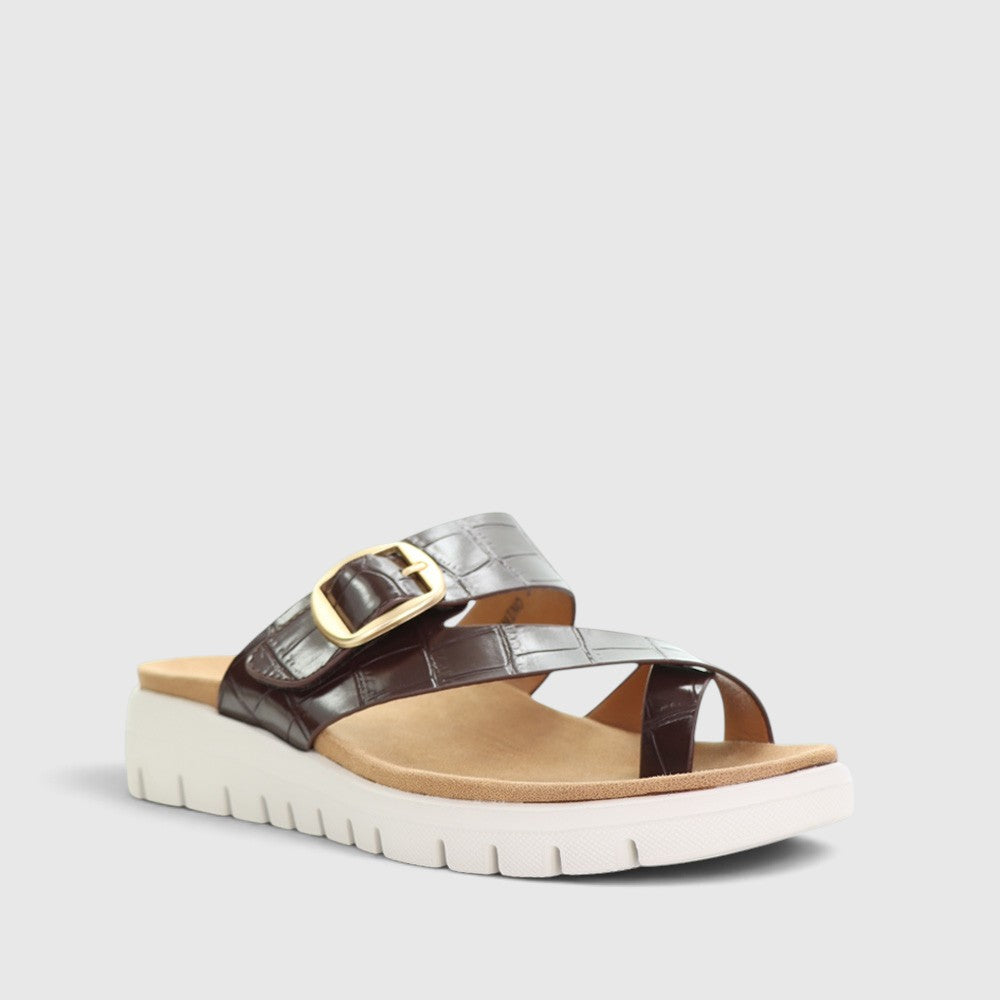 CC Resorts Domino Chocolate Crocs slip-ons featuring a sleek chocolate-brown design and comfortable casual footwear style.
