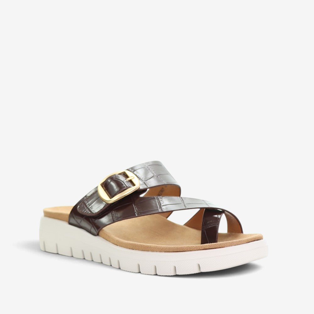 CC Resorts Domino Chocolate Crocs slip-on shoes with a sleek, chocolate brown design and comfortable, casual style.