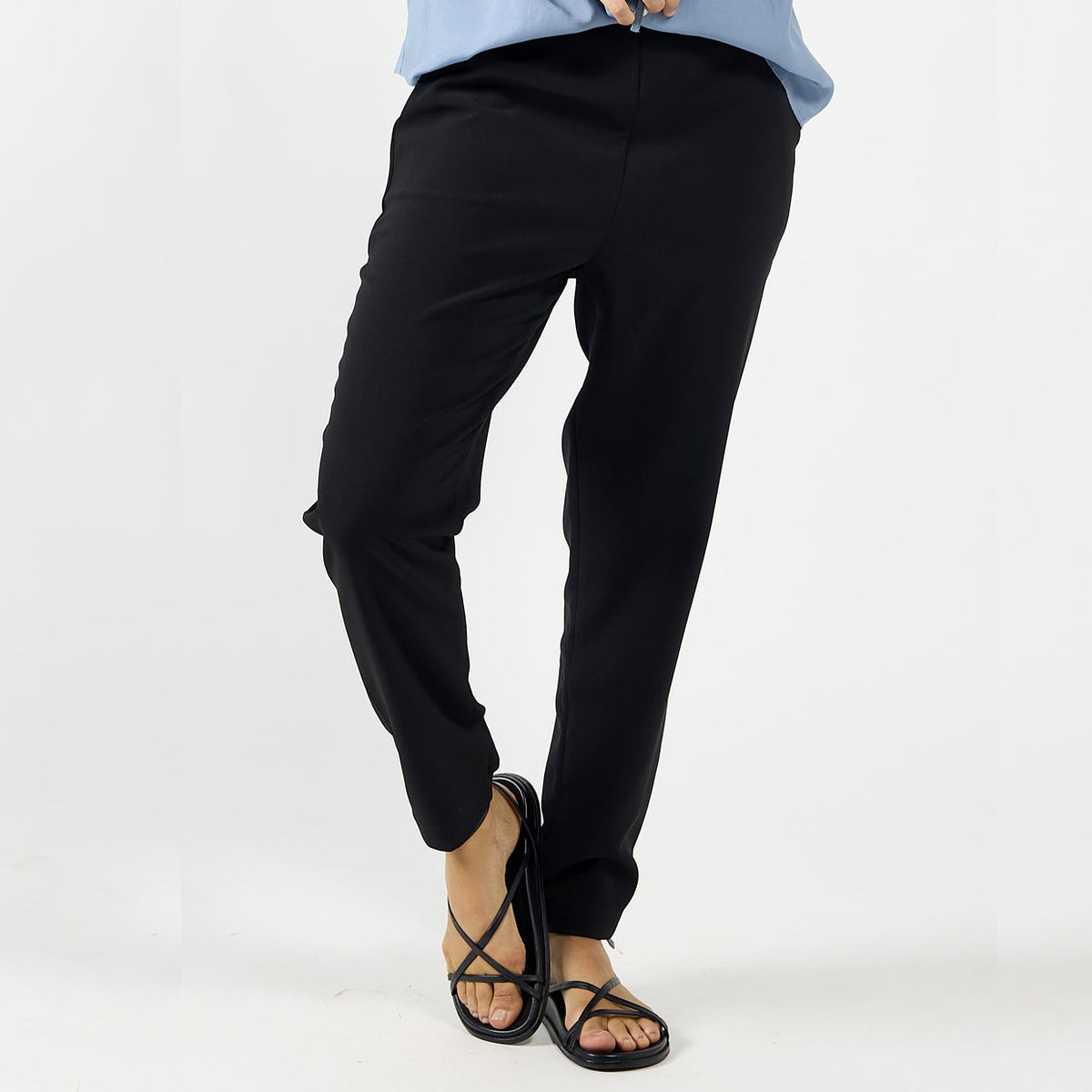 Black Drama The Label Calm Pant, stylish tapered trousers with a relaxed fit, made from comfortable fabric for versatile wear.