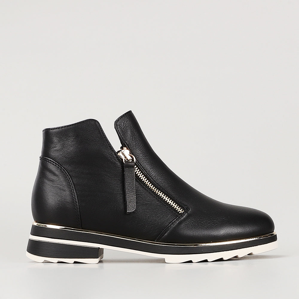 Black LE SANSA BASEL boots by Le Sansa featuring a sleek design and ankle-high silhouette with stylish laces on a white background.