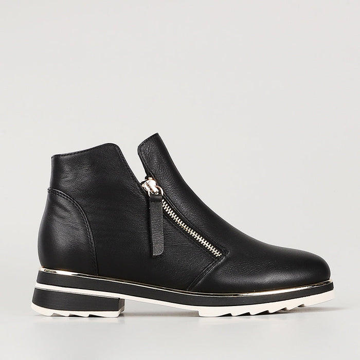 Black LE SANSA BASEL boots by Le Sansa featuring a sleek design and ankle-high silhouette with stylish laces on a white background.