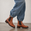Le Sansa Costa Brand y brown leather boots with lace-up design and sturdy soles, stylish and comfortable footwear.