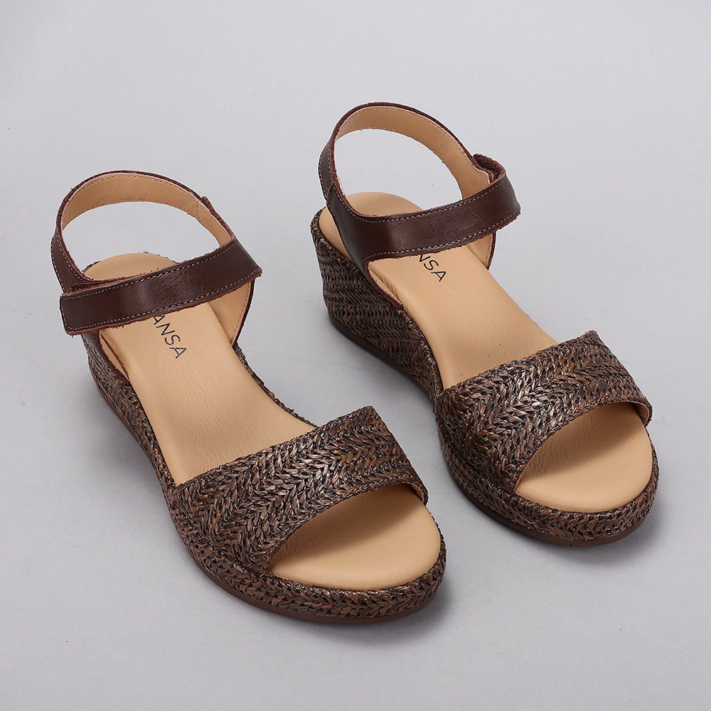 Le Sansa Pilia Chocolate sandals with strappy design and open toe, featuring a sleek brown leather finish.