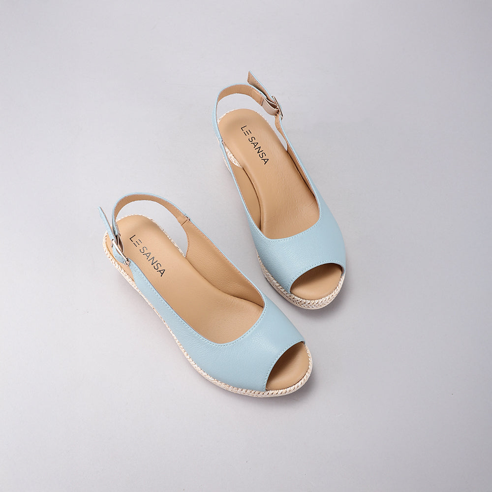 Le Sansa Petunia Baby Blue sandals with open-toe design and ankle straps, perfect for stylish summer wear.