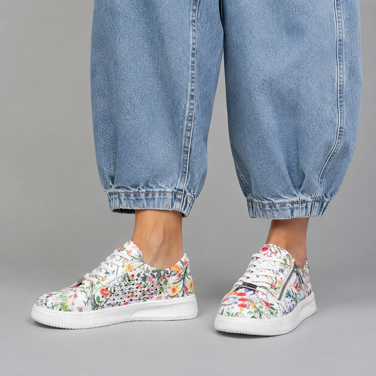 Naked Arches Noble White Floral sneakers with white background, showcasing the stylish floral design and comfortable sneaker style.