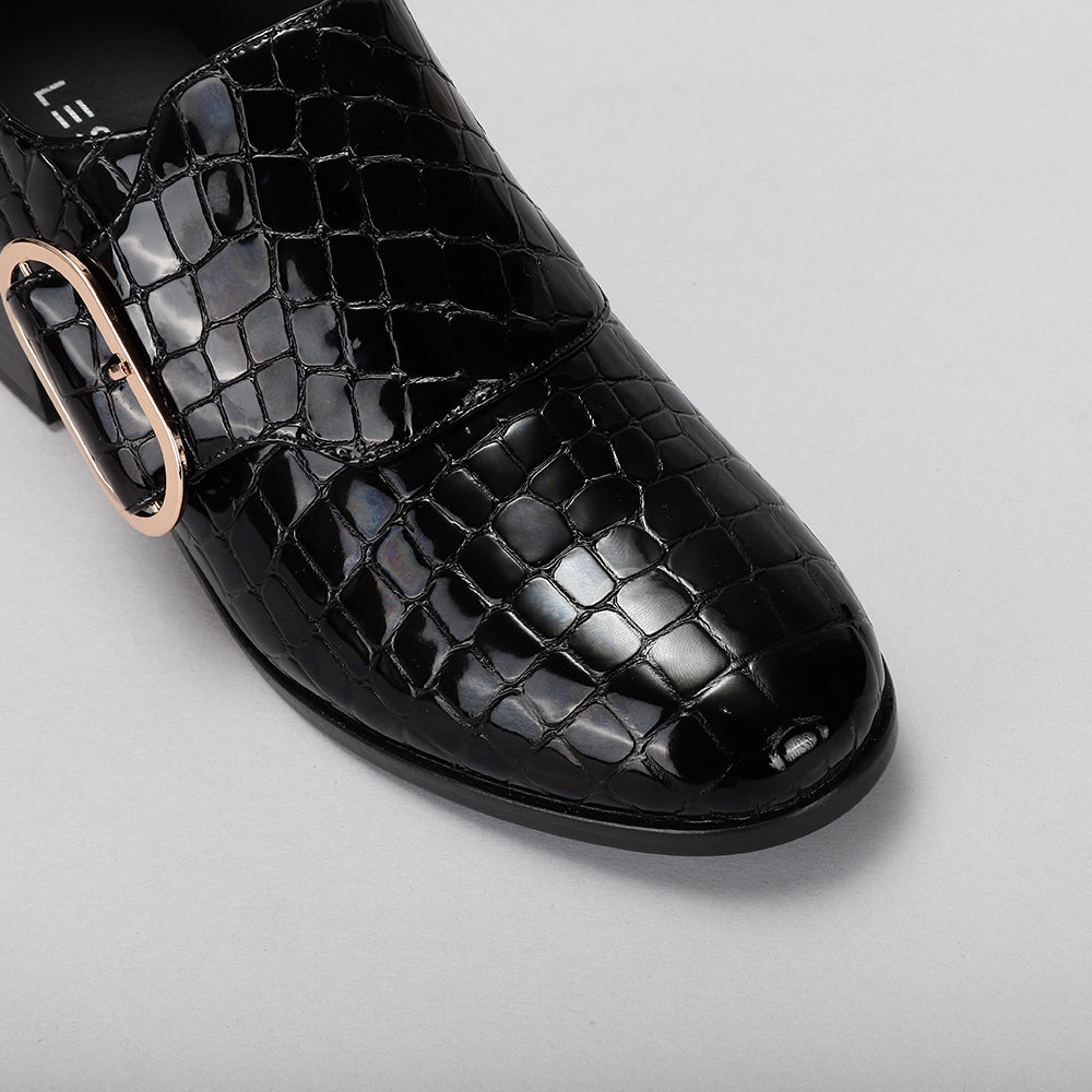 Le Sansa Rice Black Print loafers with sleek design, featuring a textured black pattern and comfortable slip-on style.