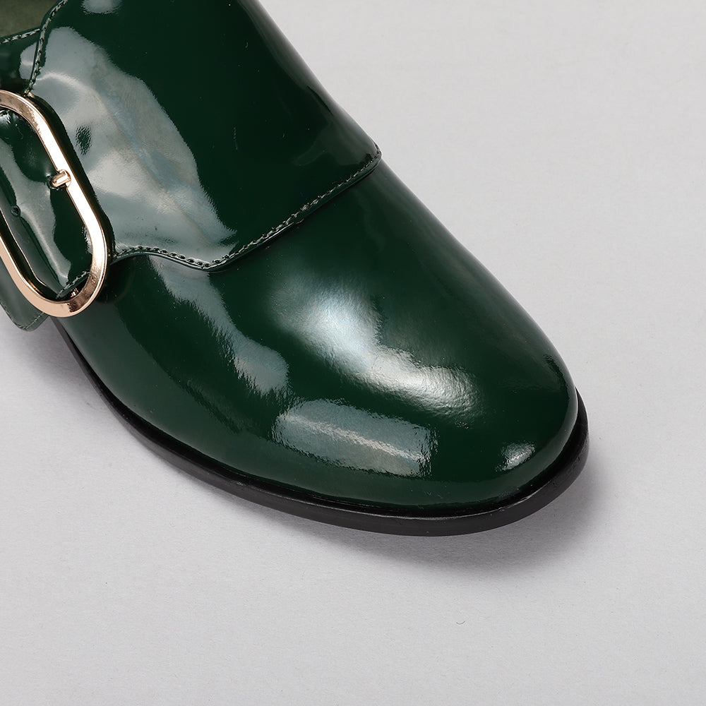 Le Sansa green loafers with sleek design and stitching detail, displayed on a plain background.