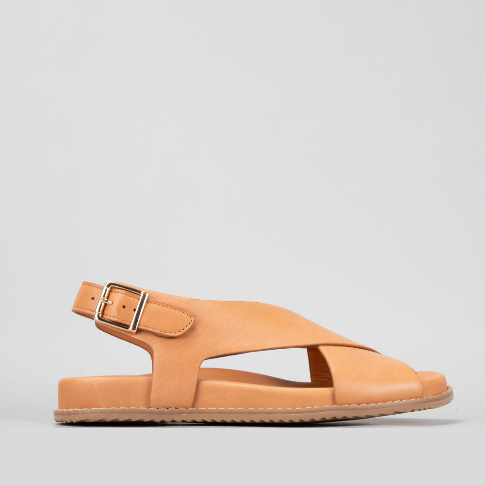 Naked Arches Zigilia Tan sandals with open-toe design and adjustable straps, showcasing natural tan leather material.