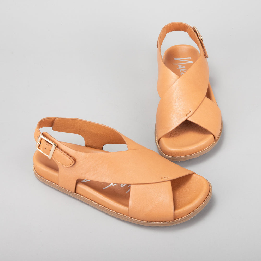 Naked Arches Zigilia Tan sandals with tan leather straps and cushioned footbed, showcasing stylish open-toe design.
