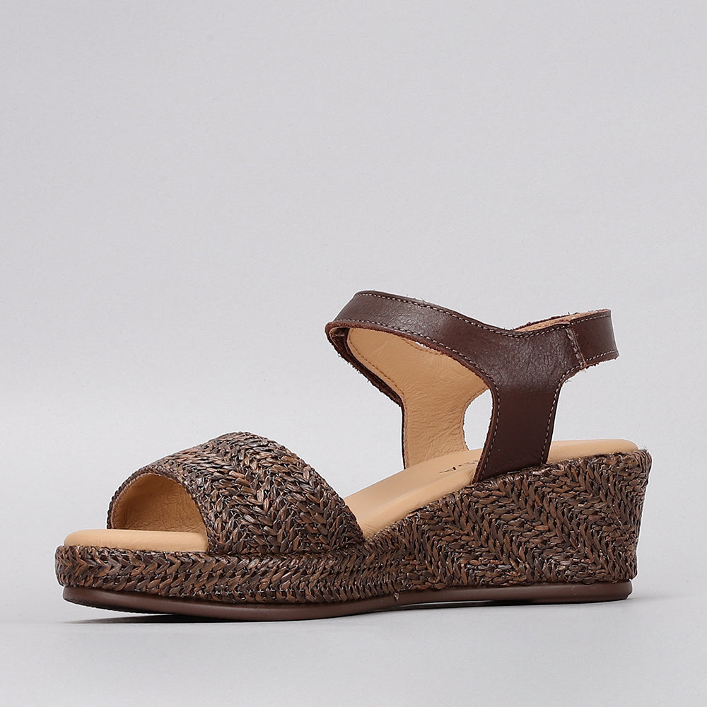 Le Sansa Pilia Chocolate sandals featuring a stylish design with chocolate brown straps and comfortable flat sole.