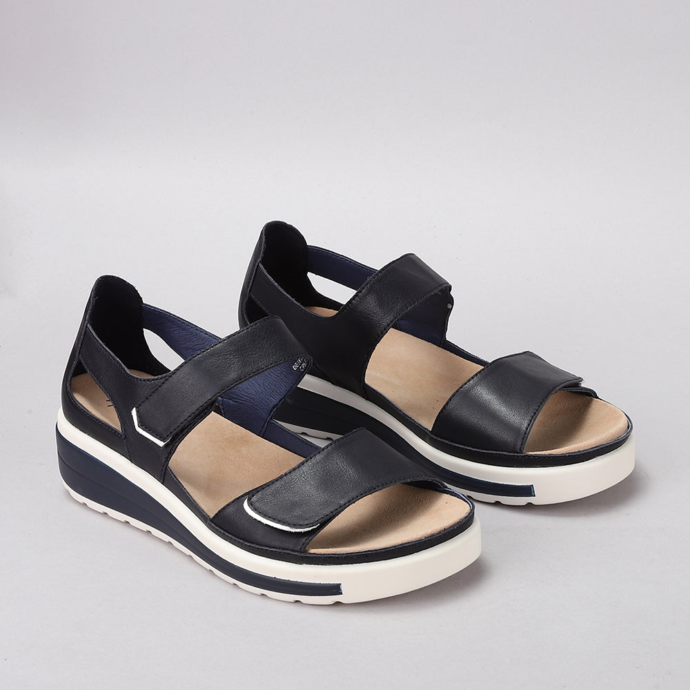 Naked Arches Happy Navy sandals with navy blue straps and cushioned footbed for comfortable casual wear.