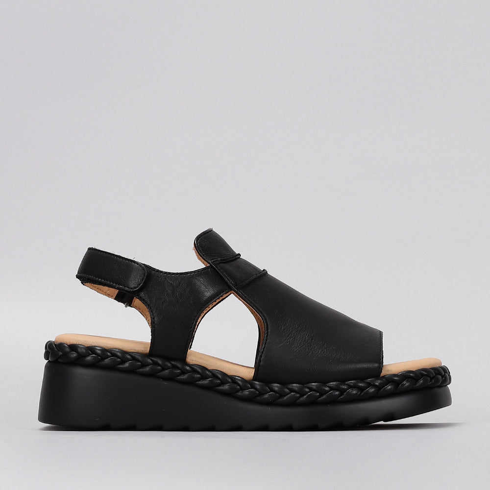 Le Sansa Sansa Emmeline black sandals featuring open toes and ankle straps, stylish and comfortable footwear for warm weather.