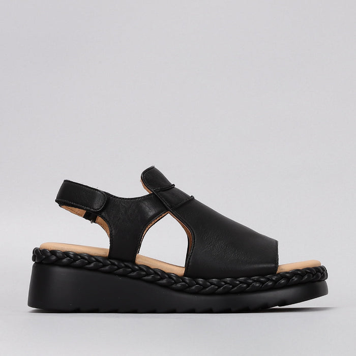 Le Sansa Sansa Emmeline black sandals featuring open toes and ankle straps, stylish and comfortable footwear for warm weather.