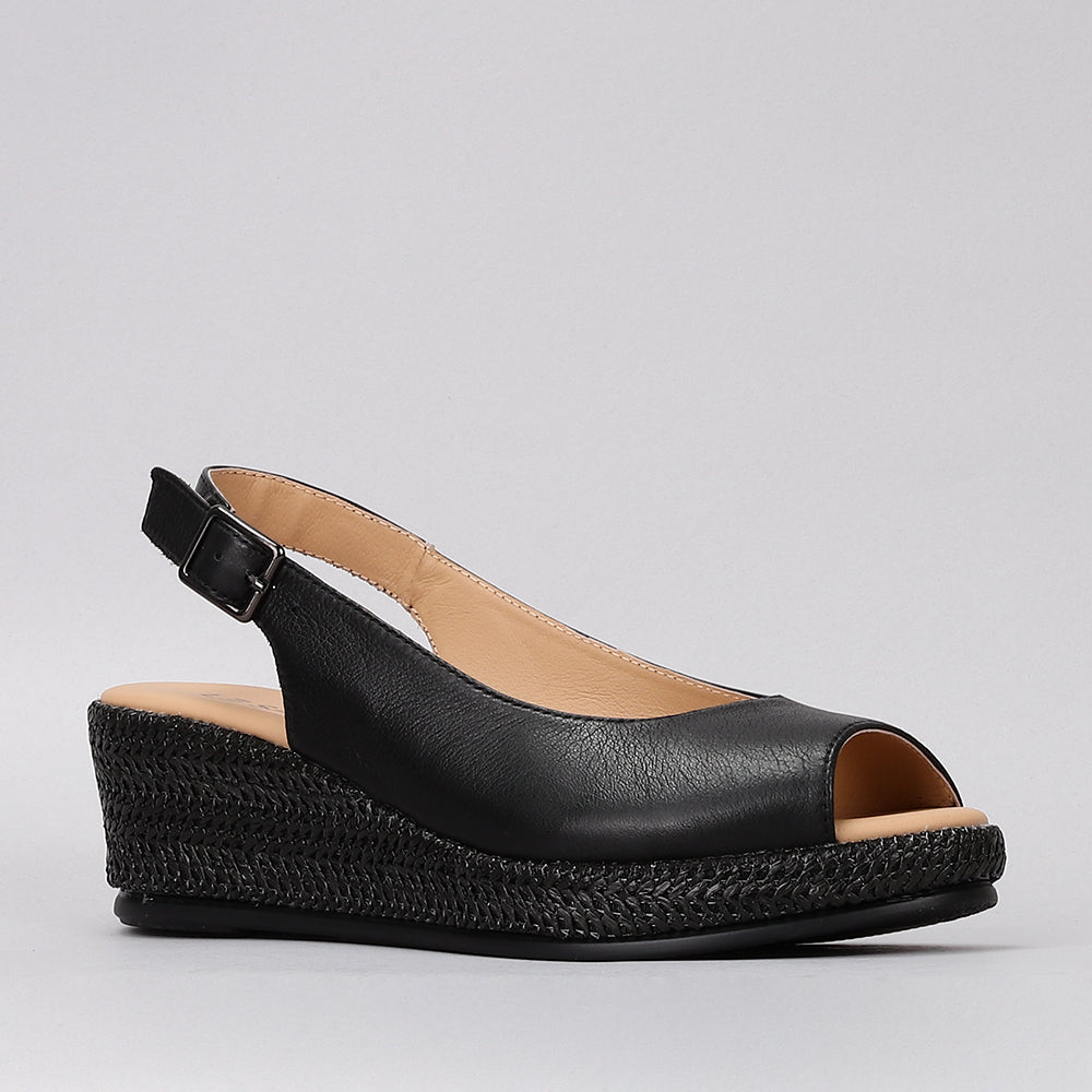 Le Sansa Petunia Black sandals featuring sleek black straps and comfortable flat sole.